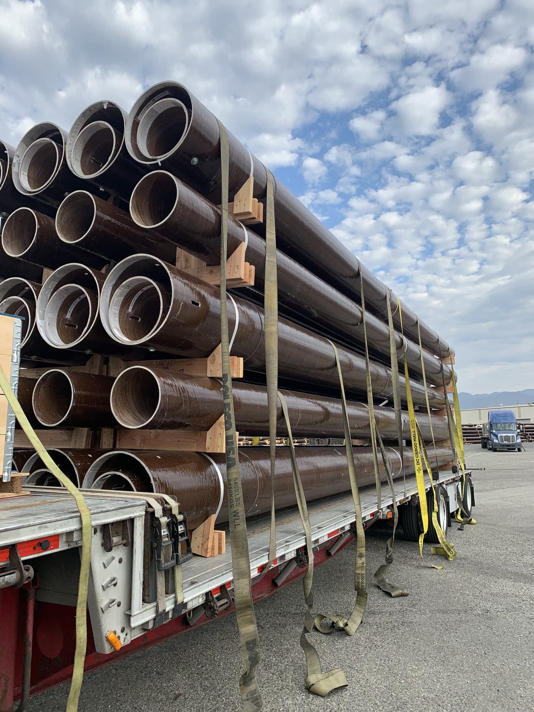 Industrial construction components secured for highway transport.